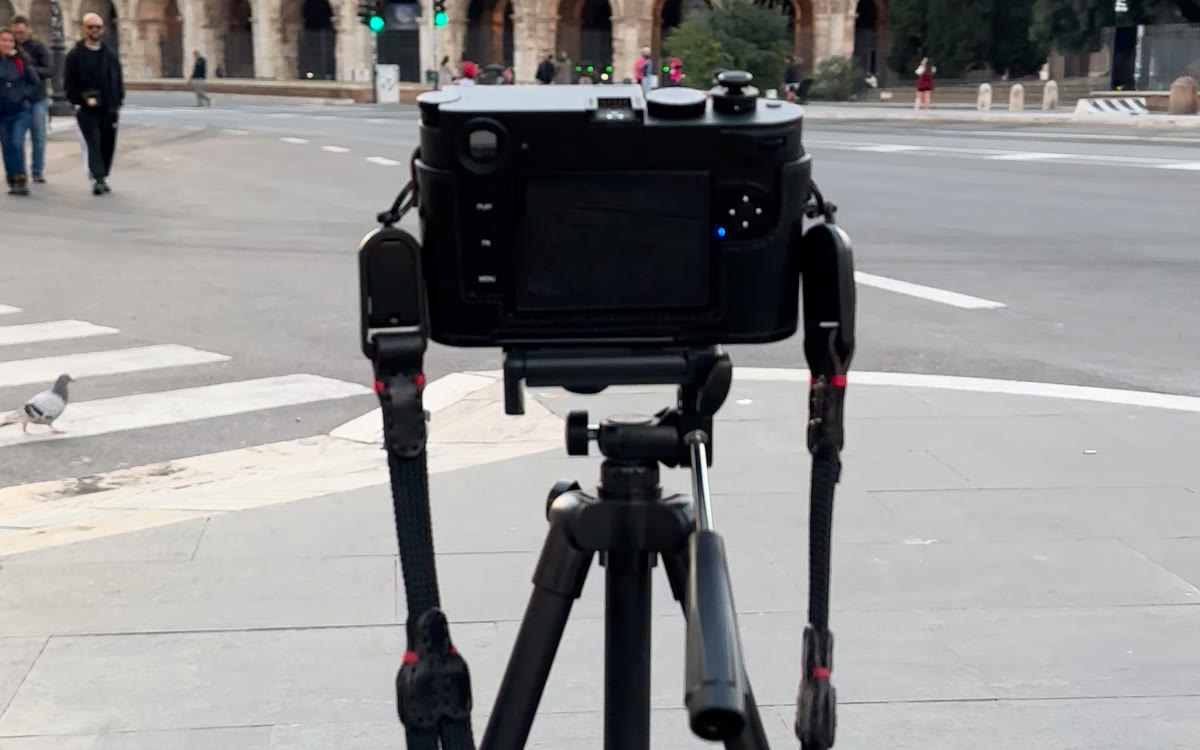 A Leica on a tripod facing the Colosseum in Rome
