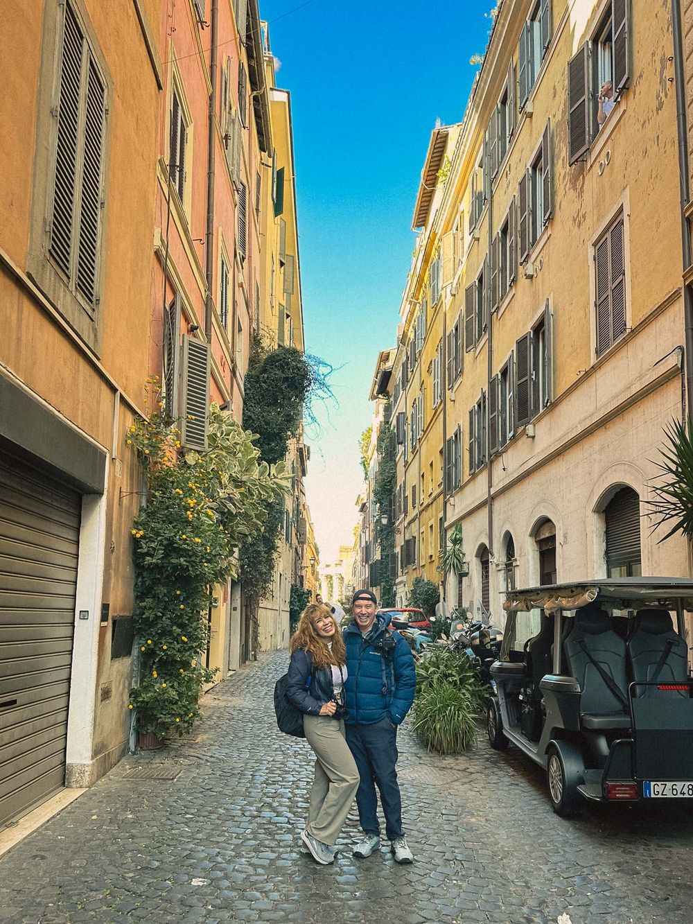 The Rome street photograph edited with the Fuji 400H preset: cooler, with a teal sky and soft grain